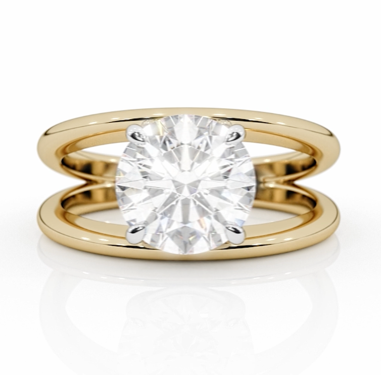 Close-up of a custom engagement ring by lessard coutu jewellery called Respire featuring highly detailed yellow gold handcrafted band and a brilliant diamond set in a delicate, handcrafted band.