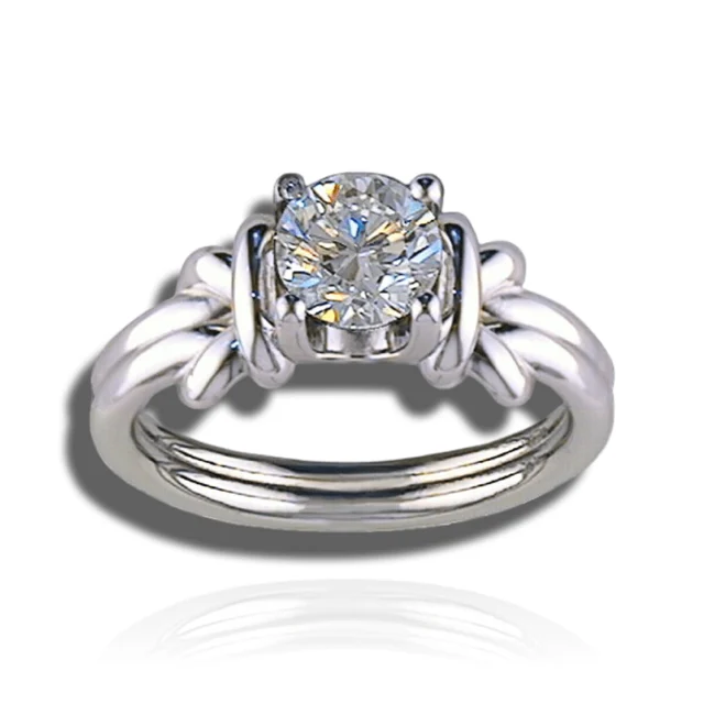 Round solitaire ring with polished loops gathered around the setting and sculpted shoulders.