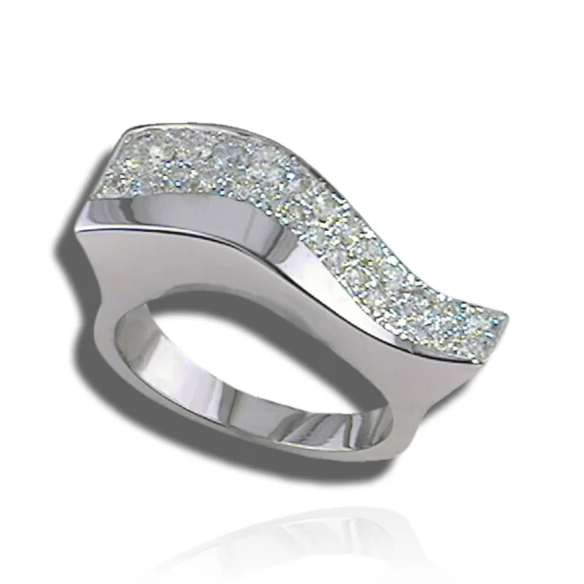 Sculptural wave ring with a broad pavé diamond surface above polished, curved sides.