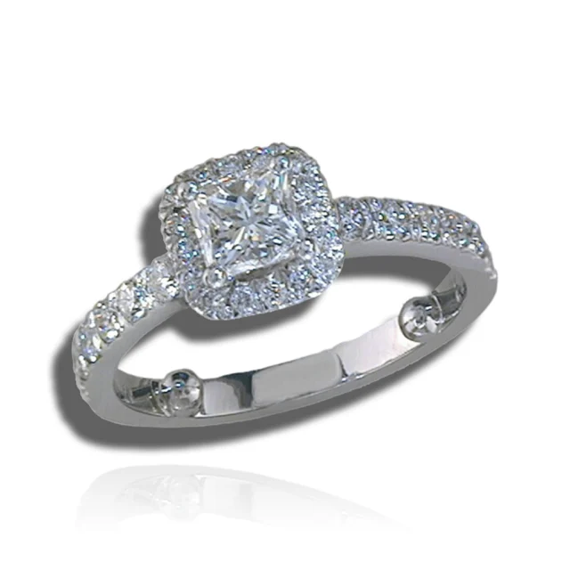 Square centre stone in a rounded-square diamond halo on a slender diamond-set band.