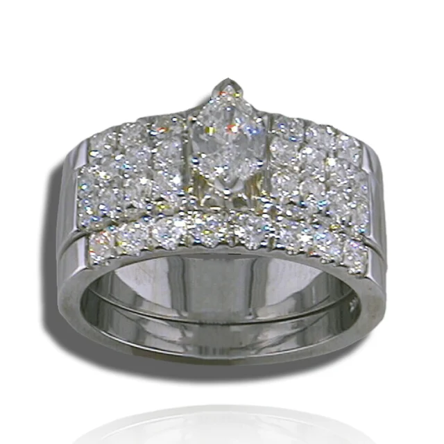 Marquise centre stone above broad diamond-set shoulders and a curved matching band.