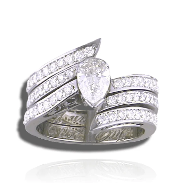 Pear centre stone framed by three rising rows of diamonds on a broad ring.