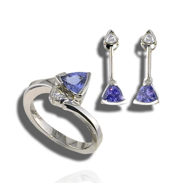 Matching ring and drop earrings with triangular violet stones and small diamond accents.